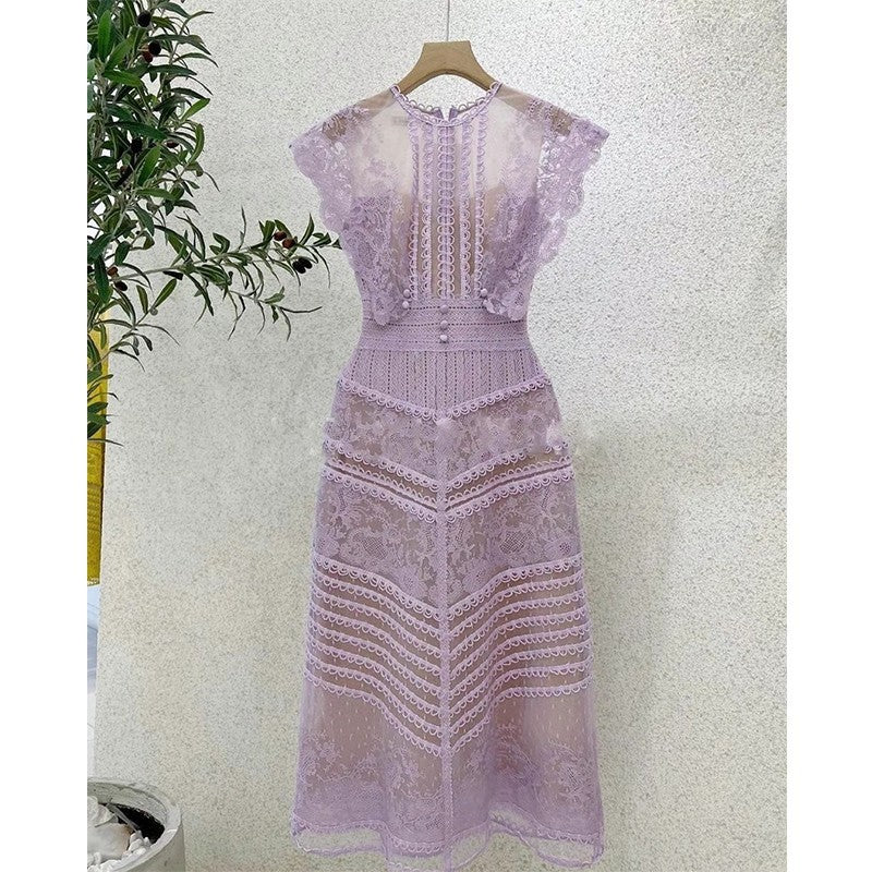Lavender lace dress on a hanger against a light background